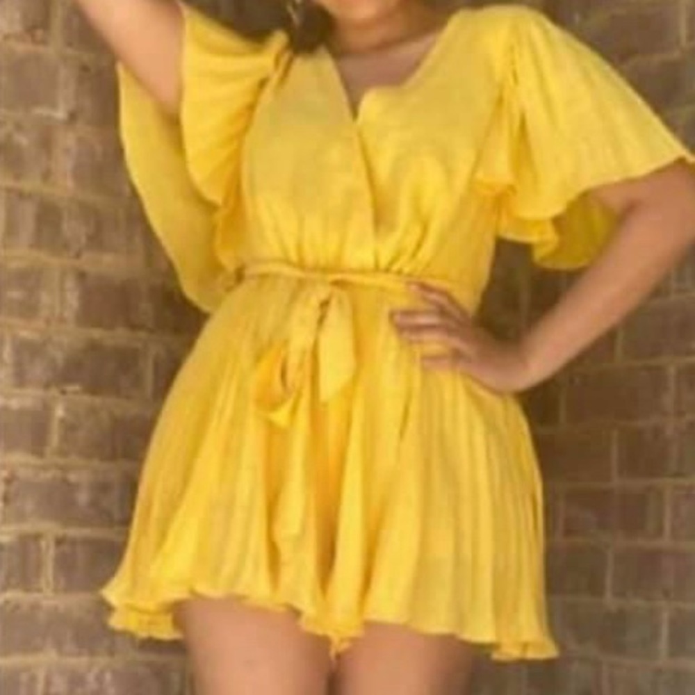 Yellow romper. NWT. Small